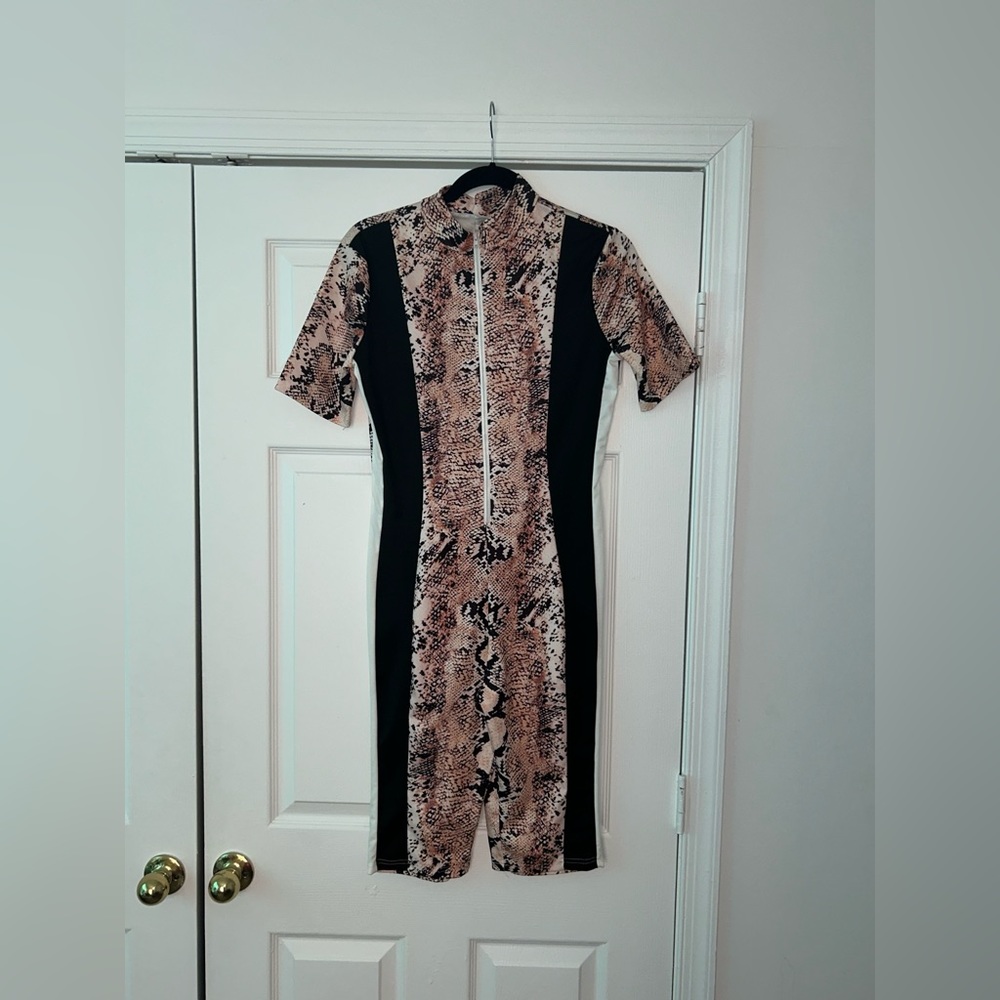 Snake print zip up romper with black and white stripes